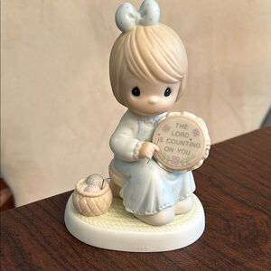 Precious Moments Porcelain Figurine with Pastel Blue Dress and Pink Bow